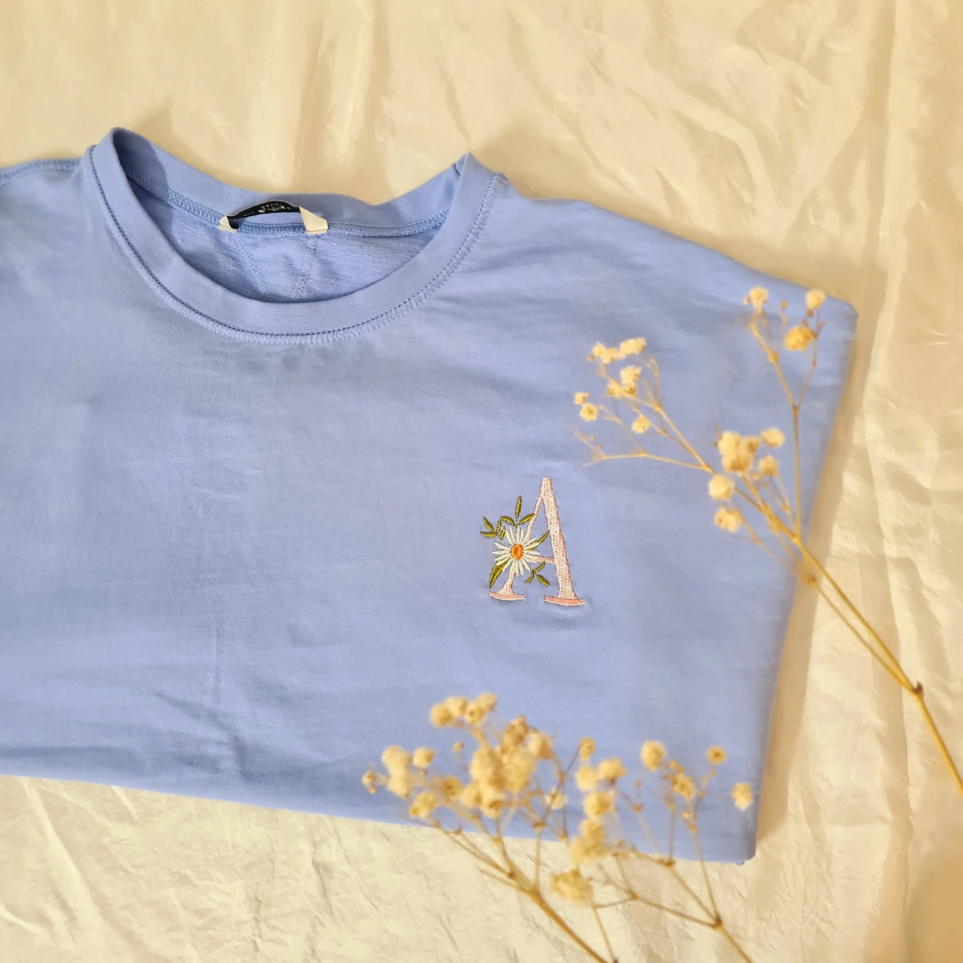 T- shirts - Letters with flowers adorned